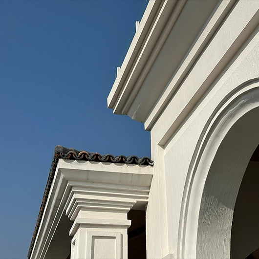Close-up of classical architectural cornice and arch details on a 1 Kanal house exterior in Bahria Enclave, Islamabad.